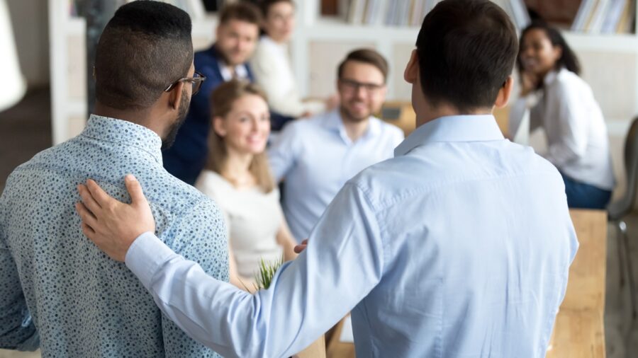 Boss introducing new worker to colleagues 