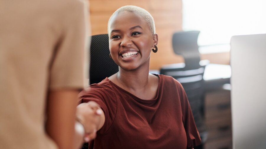 Shot Of Two Businesswomen Shaking Hands In An Office